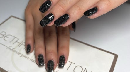 Chic black nails with sparkles at Bethan Beeston, Sandbach, England, GB, showcasing expert nail artistry.