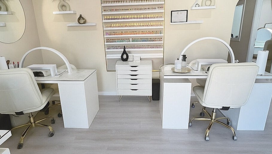 Elegant nail salon setup at ENVIOUS, Philipsburg, SX showcasing pristine workstations and stylish decor.