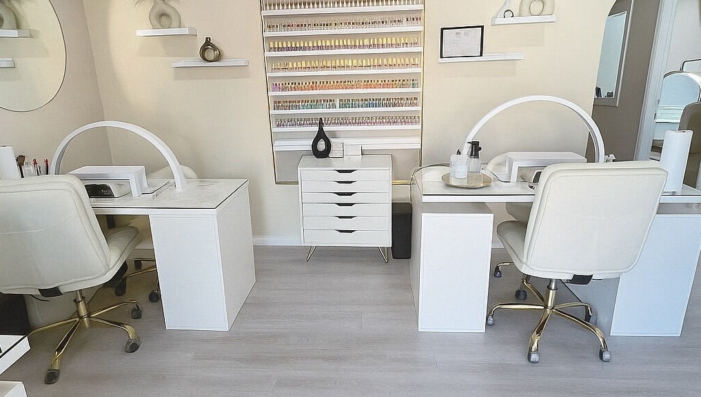 Elegant nail salon setup at ENVIOUS, Philipsburg, SX showcasing pristine workstations and stylish decor.