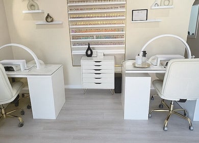 Elegant nail salon setup at ENVIOUS, Philipsburg, SX showcasing pristine workstations and stylish decor.