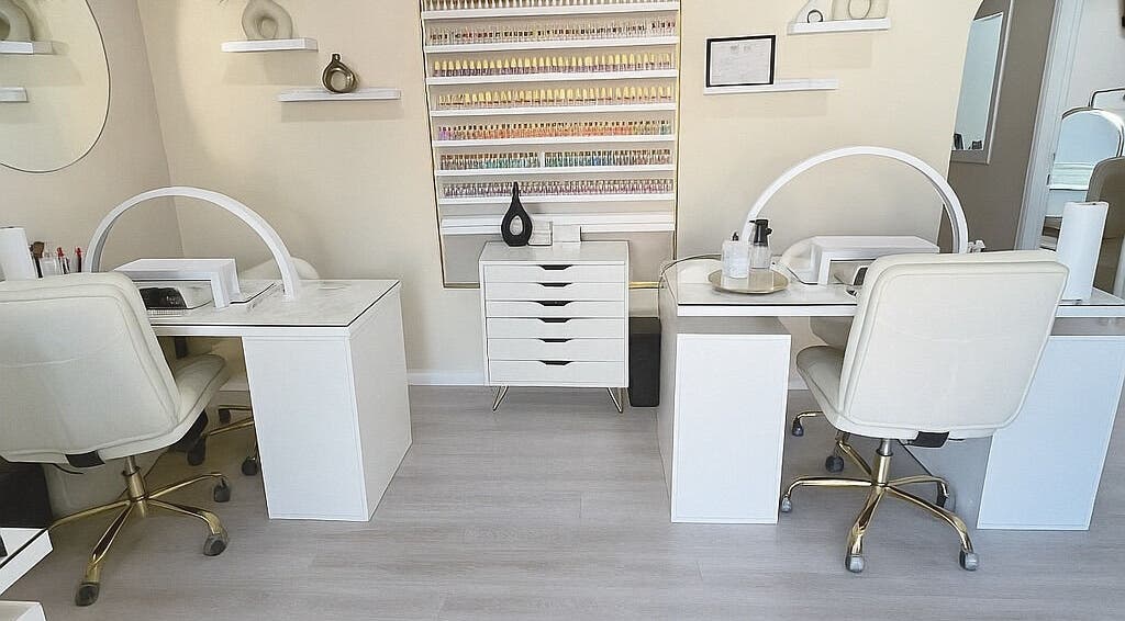 Elegant nail salon setup at ENVIOUS, Philipsburg, SX showcasing pristine workstations and stylish decor.