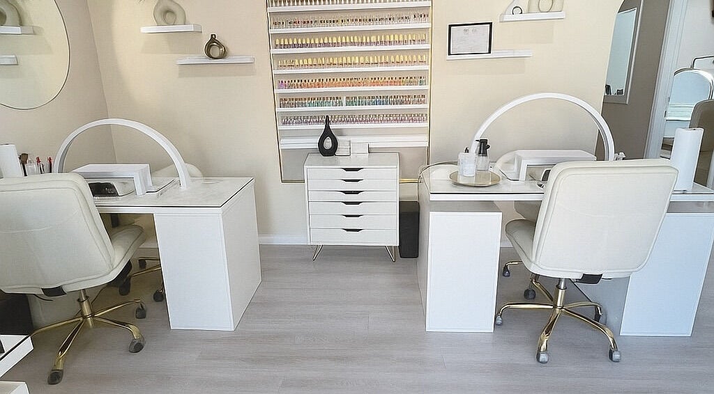 Elegant nail salon setup at ENVIOUS, Philipsburg, SX showcasing pristine workstations and stylish decor.