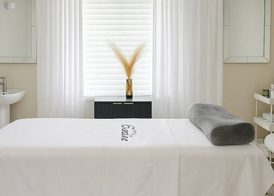 Tranquil spa room at ENVIOUS, Philipsburg, SX with massage bed and soothing decor.