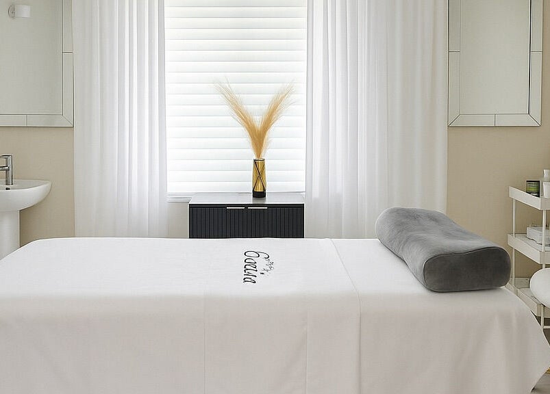 Tranquil spa room at ENVIOUS, Philipsburg, SX with massage bed and soothing decor.