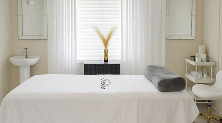 Tranquil spa room at ENVIOUS, Philipsburg, SX with massage bed and soothing decor.