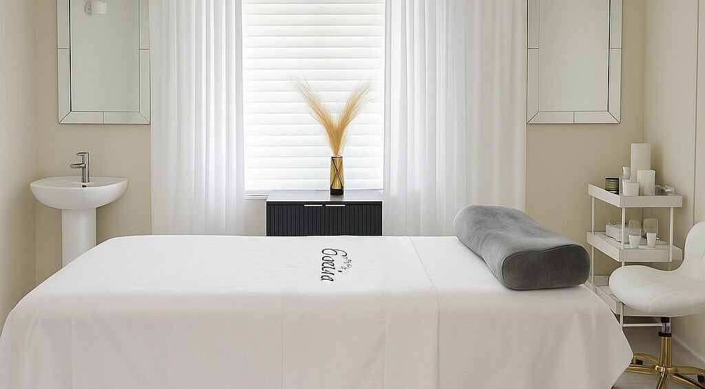 Tranquil spa room at ENVIOUS, Philipsburg, SX with massage bed and soothing decor.