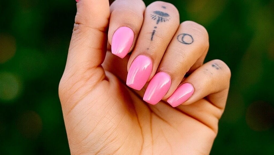 Bright pink manicured nails from Nails By Tanoo, Folkestone, England, GB, showcasing vivid color and style.
