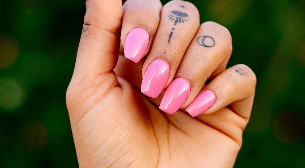 Bright pink manicured nails from Nails By Tanoo, Folkestone, England, GB, showcasing vivid color and style.