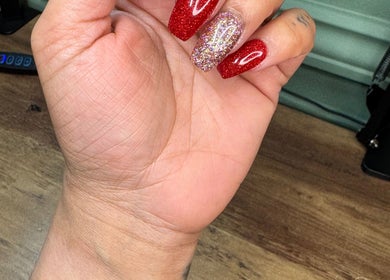 Beautiful glitter nails by Nails By Tanoo, Folkestone, England, GB showcasing elegant red and sparkly designs.