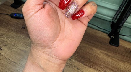 Beautiful glitter nails by Nails By Tanoo, Folkestone, England, GB showcasing elegant red and sparkly designs.
