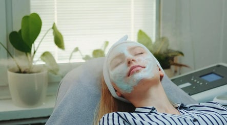 Woman enjoying a relaxing facial treatment at Realm of beauty by Lour in Springwood, Queensland, AU.