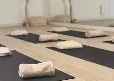 Yoga mats and towels set up at Fia Yoga & Pilates, Melbourne, Victoria, AU, ready for a calming session.