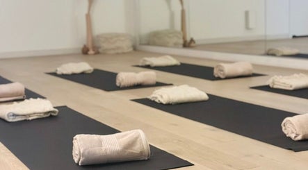 Yoga mats and towels set up at Fia Yoga & Pilates, Melbourne, Victoria, AU, ready for a calming session.