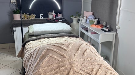 Relaxing treatment bed at Estelle Beauty - On The Range, Queensland, AU with elegant decor and soft lighting.
