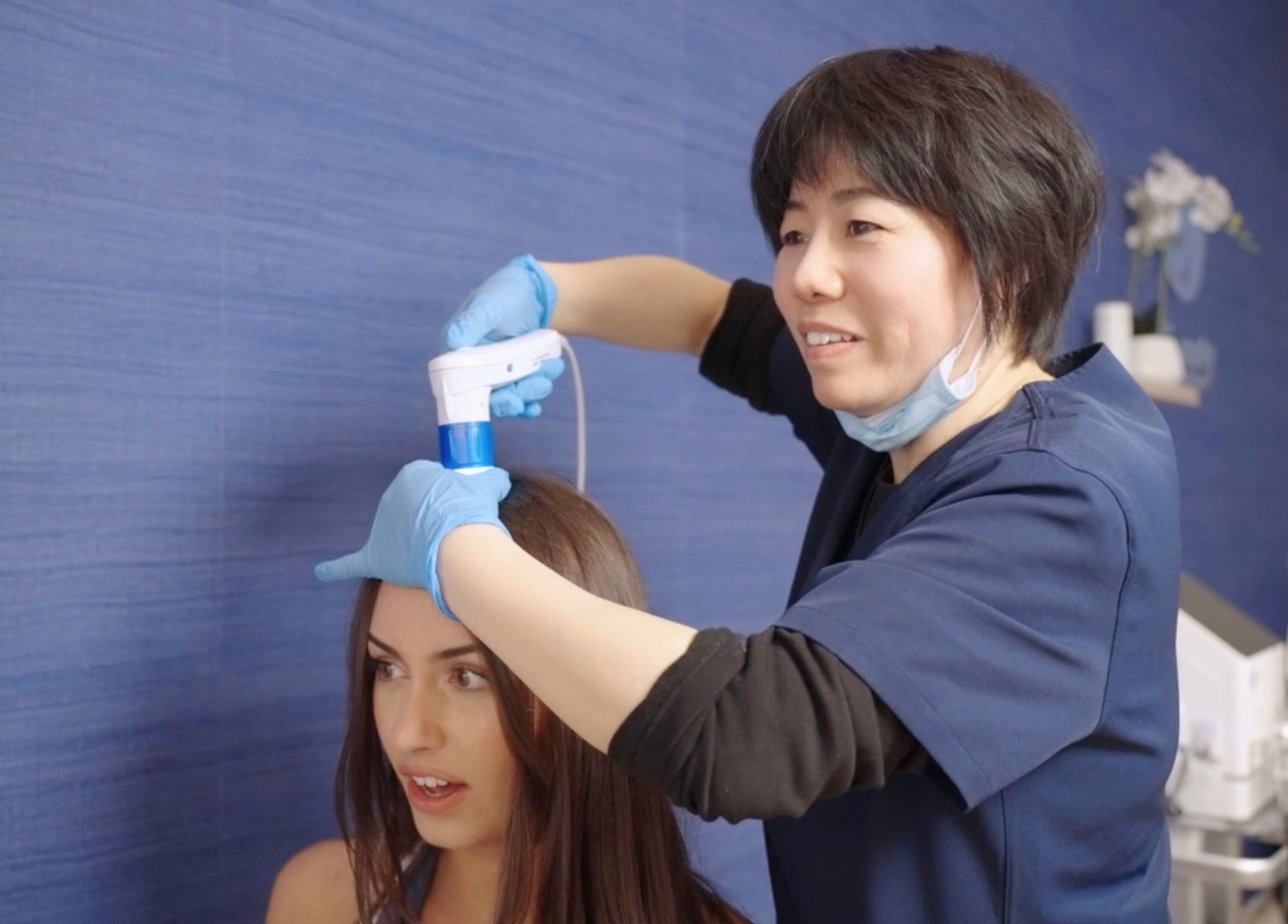 Professional treatment at Ya Beauty | St Leonards, St Leonards, New South Wales, AU. Expert using device on client's hair.