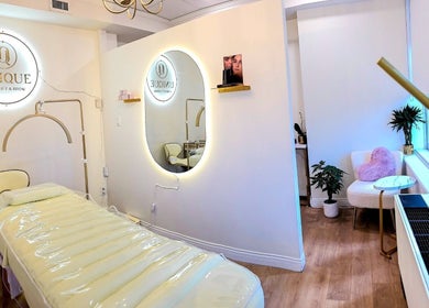 Elegant treatment room at Unique Lash Lift & Brow, Vancouver, British Columbia, CA, showcasing modern decor.