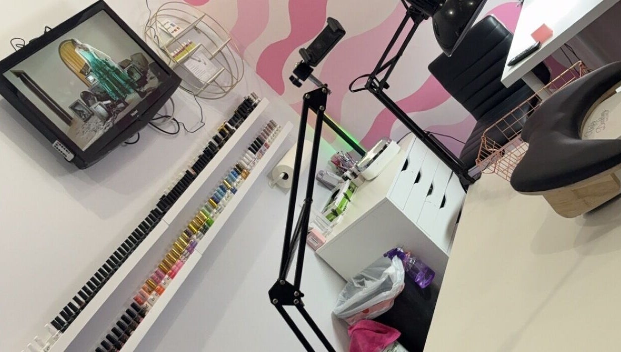 Spacious beauty setup at NailsBy.aa, Hamilton, Ontario, CA, with vibrant nail polish display and modern decor.