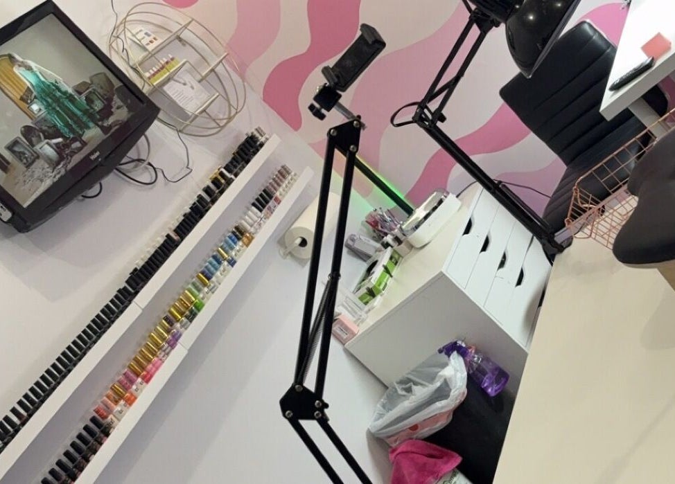 Spacious beauty setup at NailsBy.aa, Hamilton, Ontario, CA, with vibrant nail polish display and modern decor.