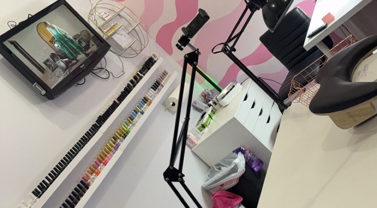 Spacious beauty setup at NailsBy.aa, Hamilton, Ontario, CA, with vibrant nail polish display and modern decor.