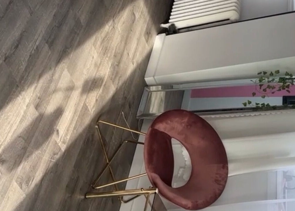 Elegant chair at NailsBy.aa in Hamilton, Ontario, CA, showcasing modern salon ambiance.