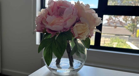 Serene pink peonies in a vase at Eating Disorders Melbourne, Melbourne, Victoria, AU.