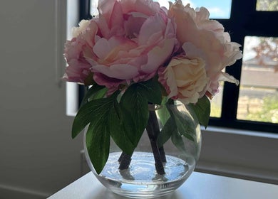 Elegant pink and cream blossoms in a glass vase at Eating Disorders Melbourne, Melbourne, Victoria, AU.