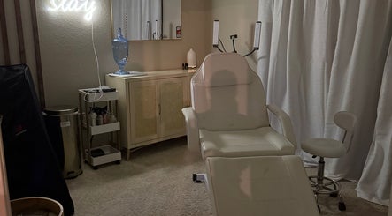 Relaxing treatment room at Aesthetinks Wellness Studio, Riverview, Florida, US, with a plush reclining chair.