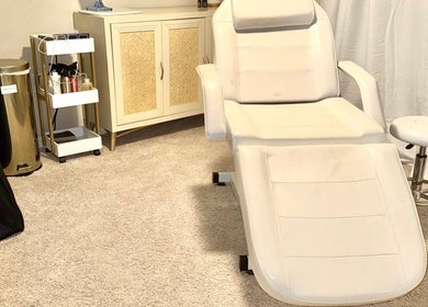 Luxurious treatment chair at Aesthetinks Wellness Studio, Riverview, Florida, US, offering a relaxing environment.