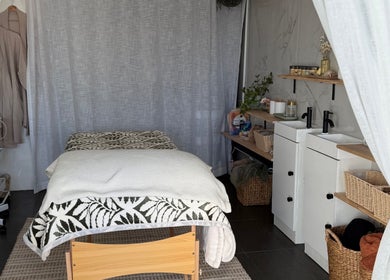 Tranquil massage room at Nothin Knotty, Kogarah, New South Wales, AU with cozy decor and massage table.