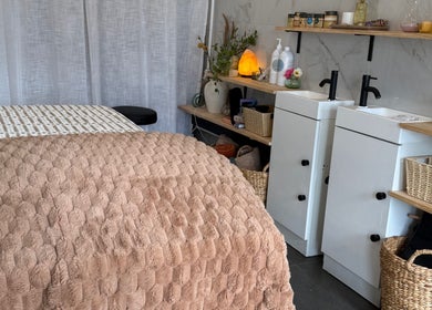 Cozy spa room with massage bed at Nothin Knotty, Kogarah, New South Wales, AU. Calm ambiance for relaxation.
