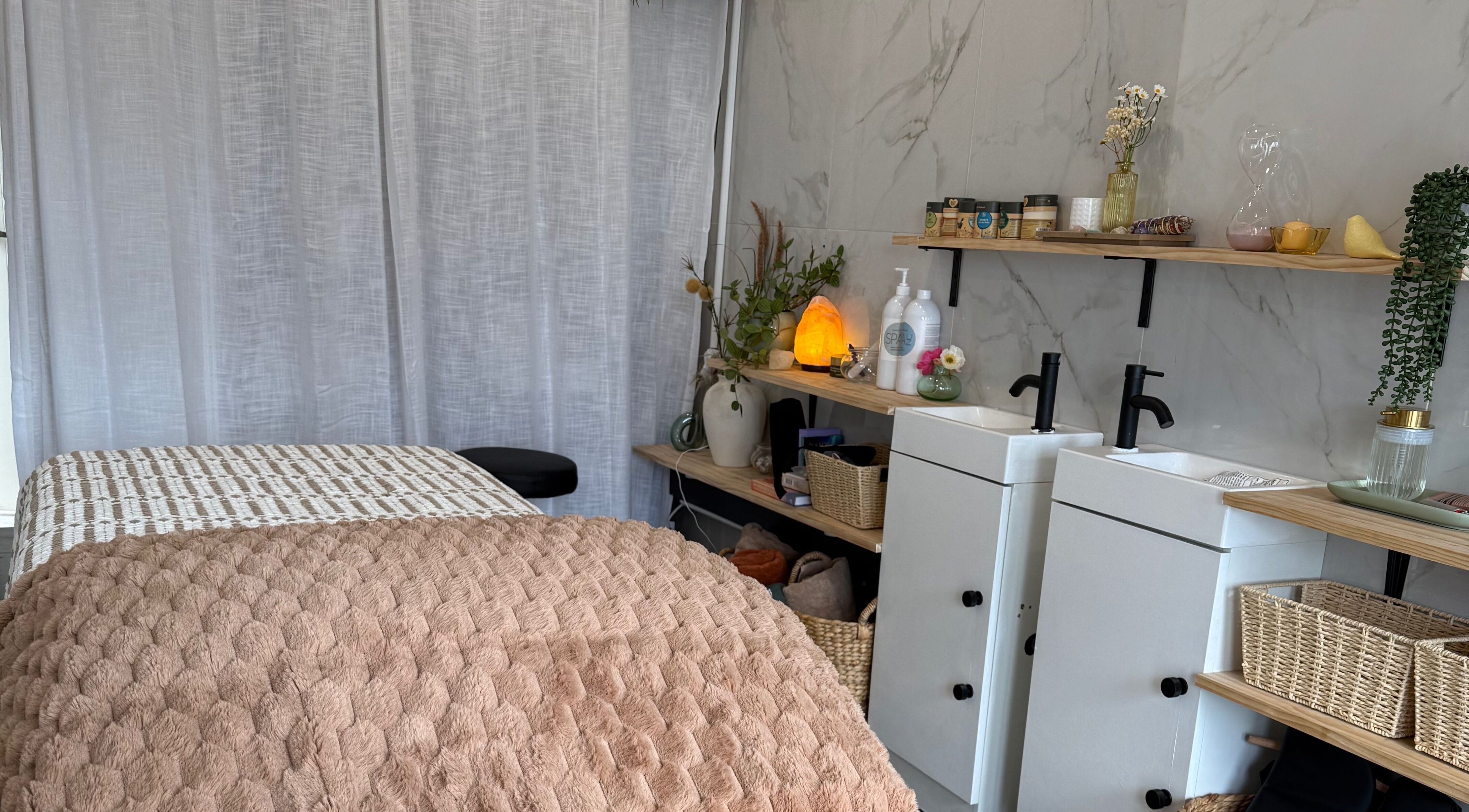 Cozy massage room at Nothin Knotty, Kogarah, New South Wales, AU with a warm, relaxing ambiance.