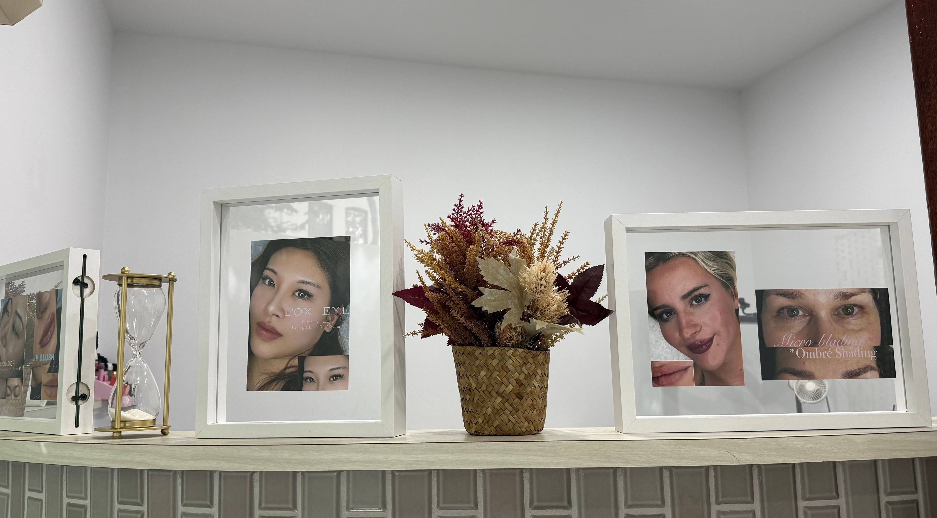 Decorative shelf with framed photos at Lumi Lash & Brow, Ultimo, New South Wales, AU.