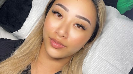 Client with flawless skin and defined lashes at SKULPTED, Fairfield, New South Wales, AU.