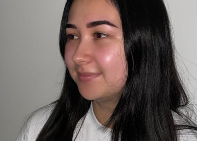Woman with radiant skin after beauty treatment at SKULPTED, Fairfield, New South Wales, AU.