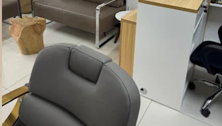 Stylish interior of X Hair and Beauty Salon in Quatre Bornes, Plaines Wilhems District, MU with modern seating.