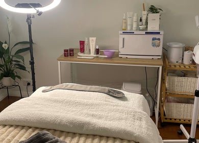 Spa room at Luminous Skin and Beauty by Maris, Duncraig, Western Australia, AU featuring a cozy bed and skincare products.