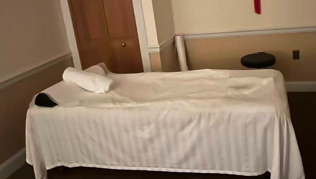 Tranquil massage bed at Acupressure Spa, Burke, Virginia, US, promising relaxation and rejuvenation.