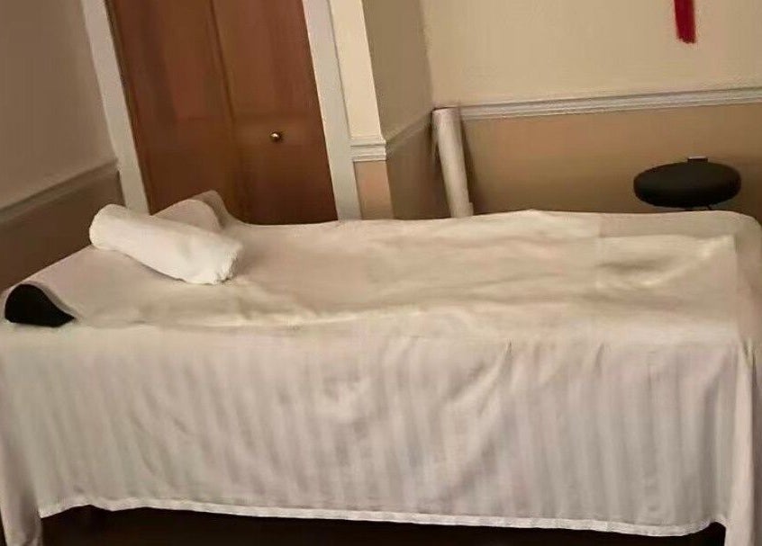 Tranquil massage bed at Acupressure Spa, Burke, Virginia, US, promising relaxation and rejuvenation.