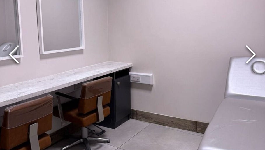 Modern treatment room at Beautyyou Aesthetic & Cosmetology, Waterford, County Waterford, IE. Comfortable chairs and table.