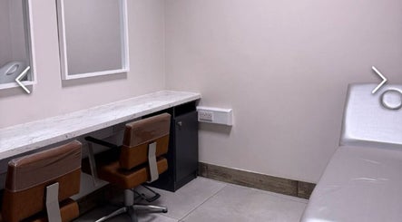 Modern treatment room at Beautyyou Aesthetic & Cosmetology, Waterford, County Waterford, IE. Comfortable chairs and table.