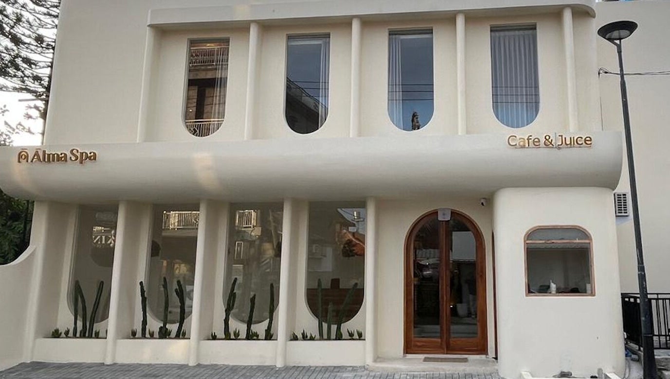 Elegant facade of Alma Spa Bali Canggu, located in Bali, Bali, ID, with modern design and cafe signage.