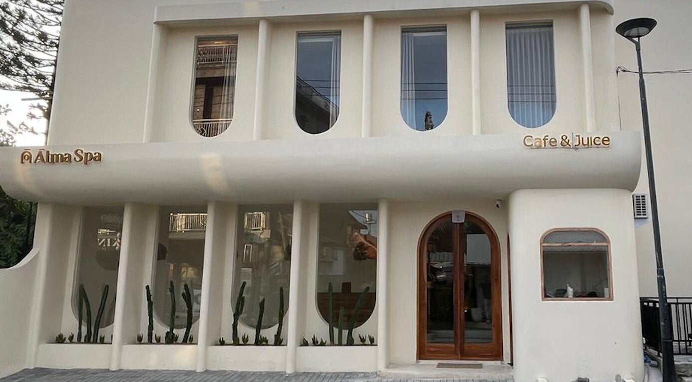 Elegant facade of Alma Spa Bali Canggu, located in Bali, Bali, ID, with modern design and cafe signage.