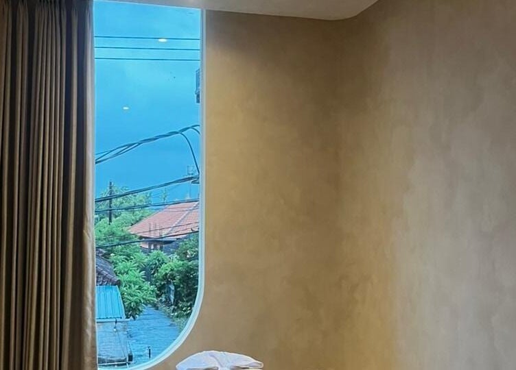 Peaceful massage room at Alma Spa Bali Canggu with scenic view outside. Located in Bali, Bali, ID.