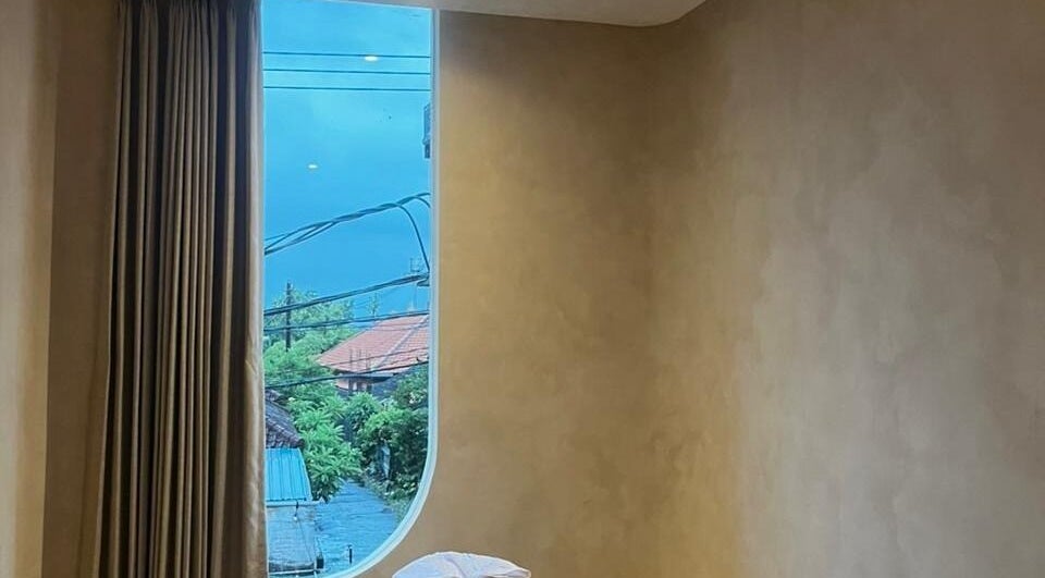 Peaceful massage room at Alma Spa Bali Canggu with scenic view outside. Located in Bali, Bali, ID.