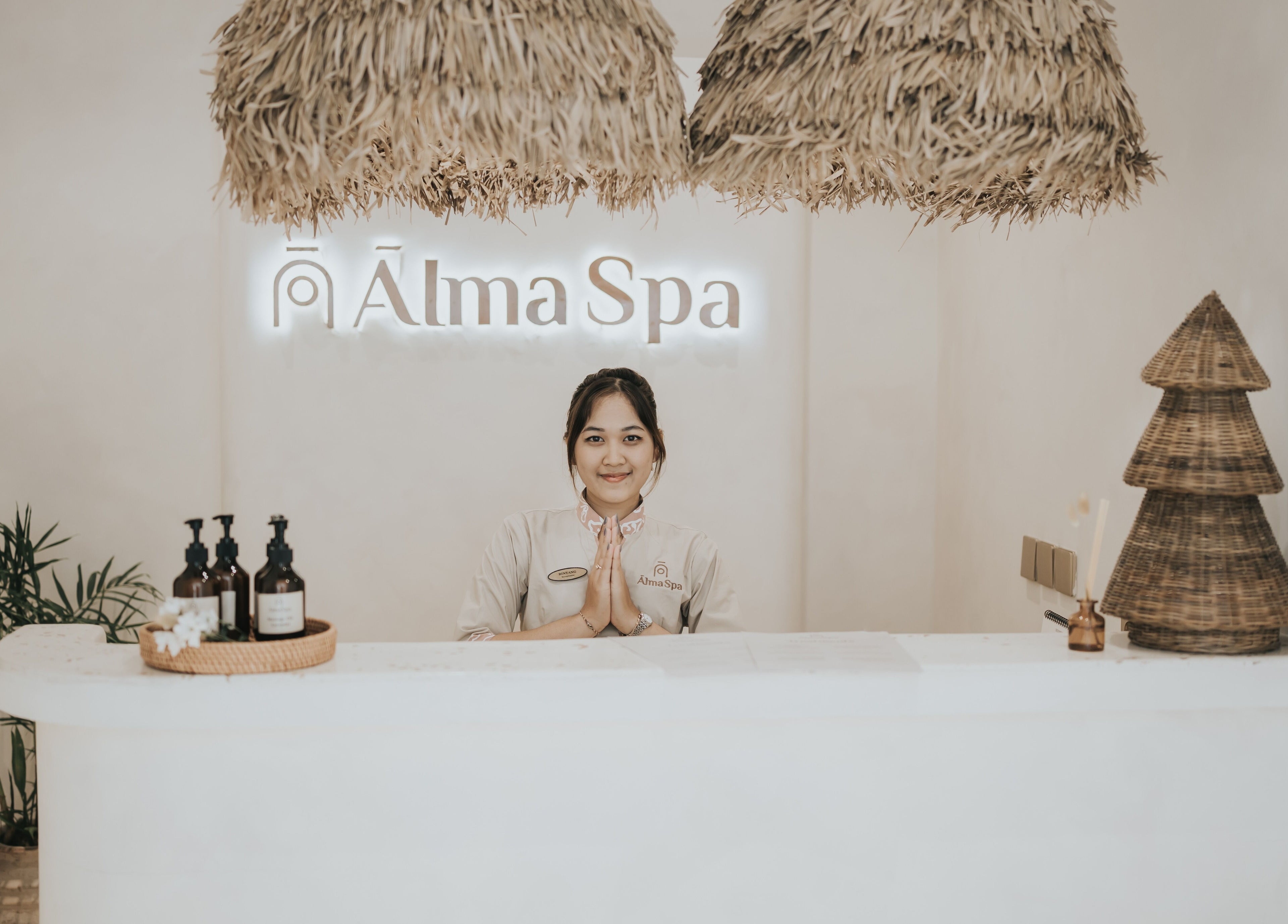 Receptionist greeting at Alma Spa Bali Canggu, Bali, Bali, ID with serene decor and friendly ambiance.