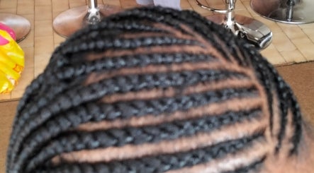 Intricate braid hairstyle at 8 Dunlin Road, Terenure, Kempton Park, ZA salon.