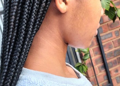 Close-up of braided hairstyle at Kempton Park, Gauteng, ZA. Showcasing expert craftsmanship in hair artistry.