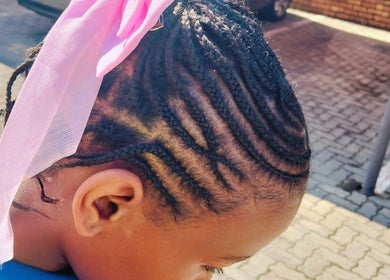 Intricate braids with pink ribbon at 8 Dunlin road Terenure, Kempton Park, Gauteng, ZA.