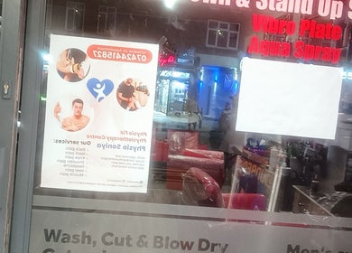 Physical therapy poster on shop window in Greenford, England, GB with service details.