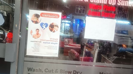 Physical therapy poster on shop window in Greenford, England, GB with service details.